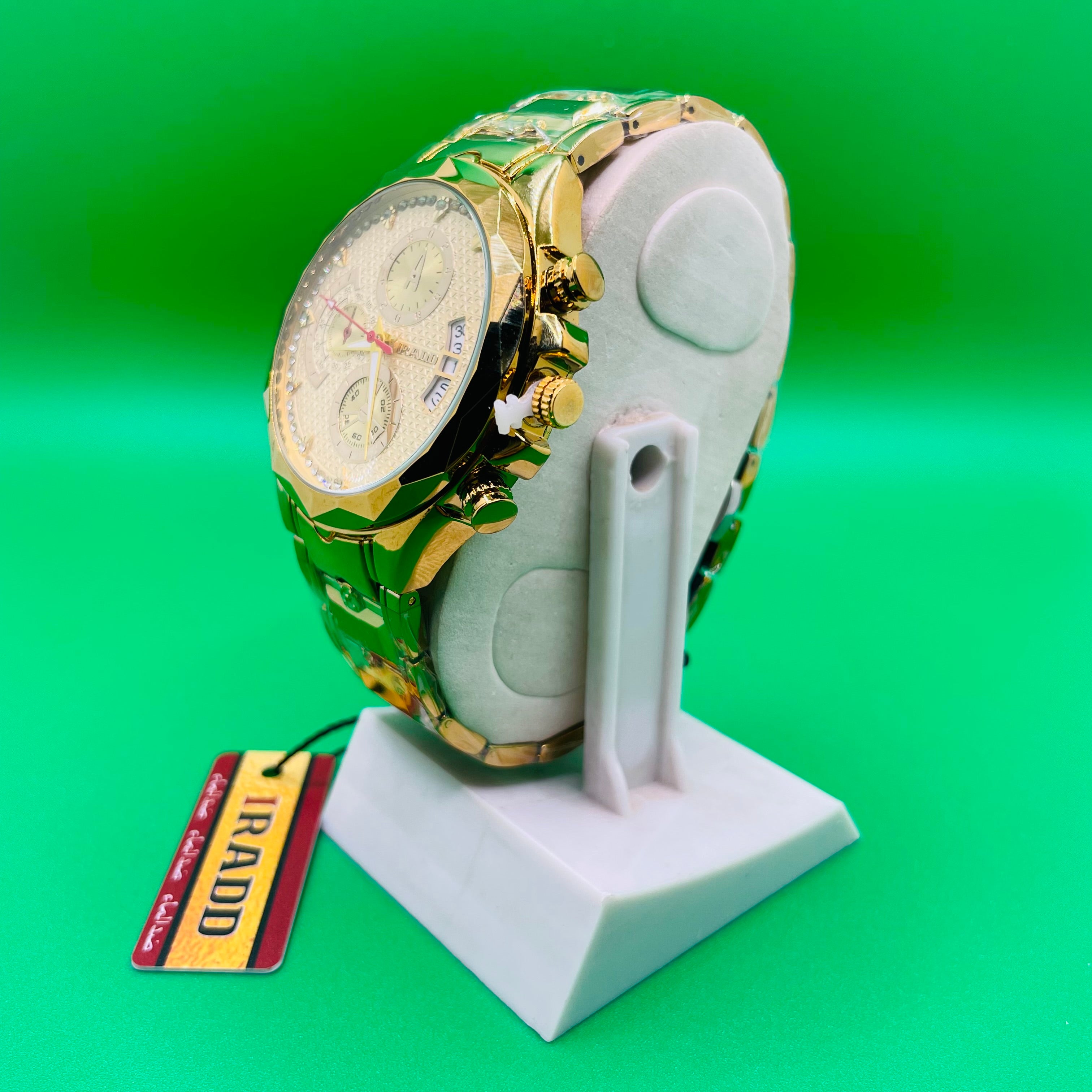 Gold and green Luxury watch IRADD 8115 on a white stand with a green background