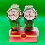 Two metallic IRADD 8115 on a stand with a green background