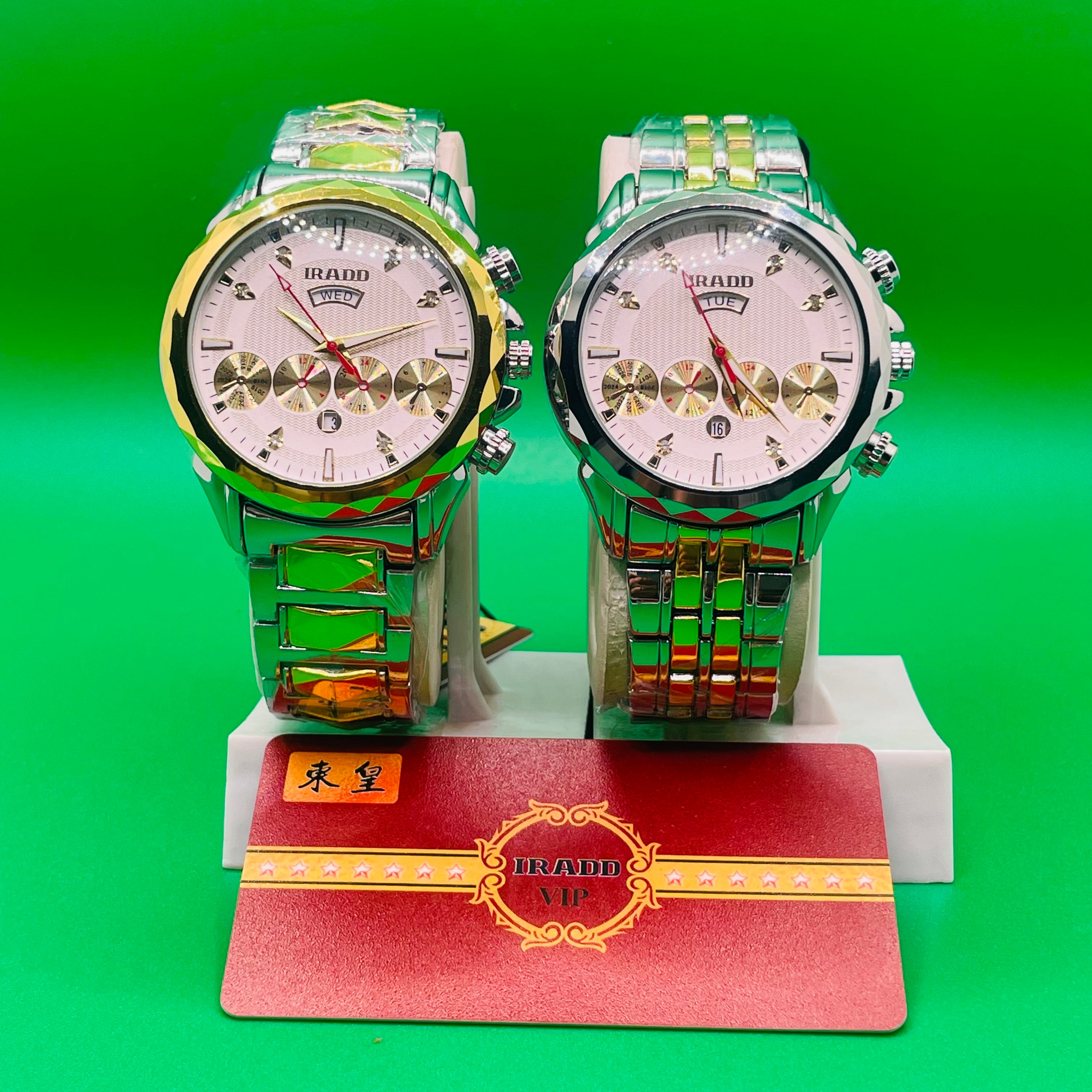 Two metallic IRADD 8115 on a stand with a green background
