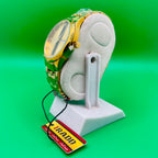 IRADD Watch on a stand with a green background