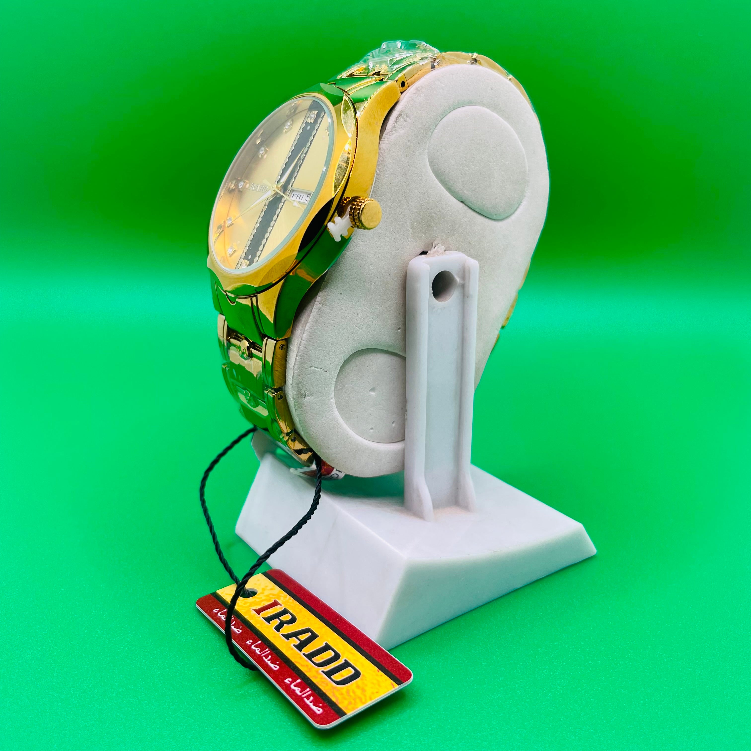 IRADD Watch on a stand with a green background