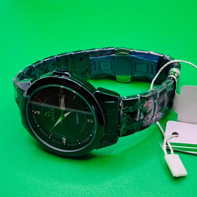 Green wristwatch with charging cable on a green background