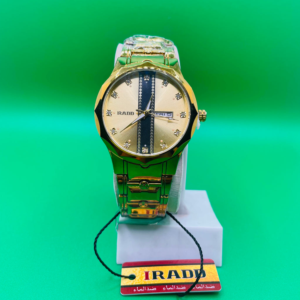 Gold watch on a green background with an IRAD brand tag.