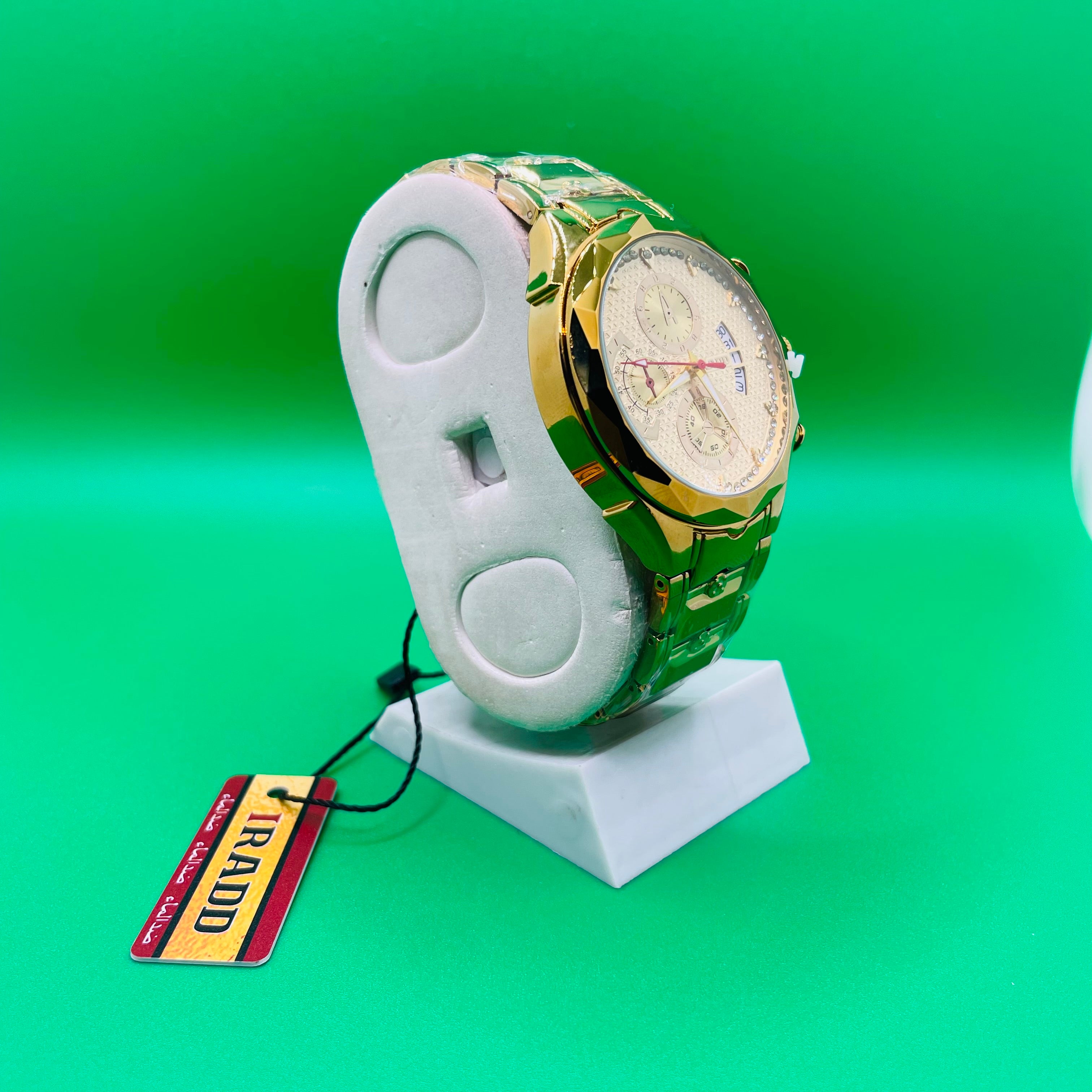 Gold and green Luxury watch IRADD 8115 on a white stand with a green background